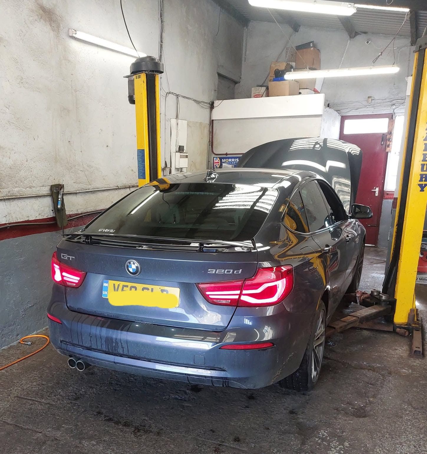 BMW 320d on the lift in the workshop